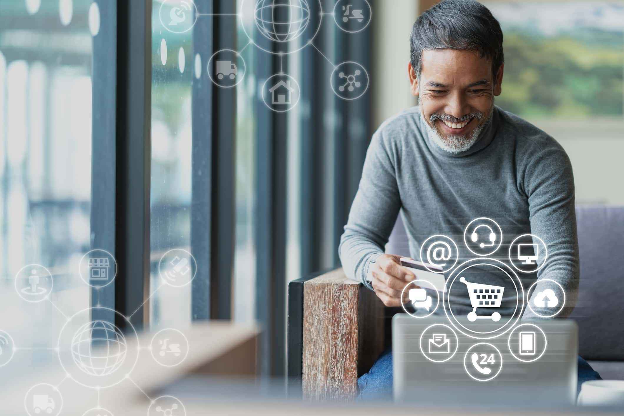 Asian Or Hispanic Man Using Laptop And Credit Card Payment Shopping Online With Icon Customer Network Connection On Screen And Connecting With Omni Channel System. Older Man Satisfied With CRM System