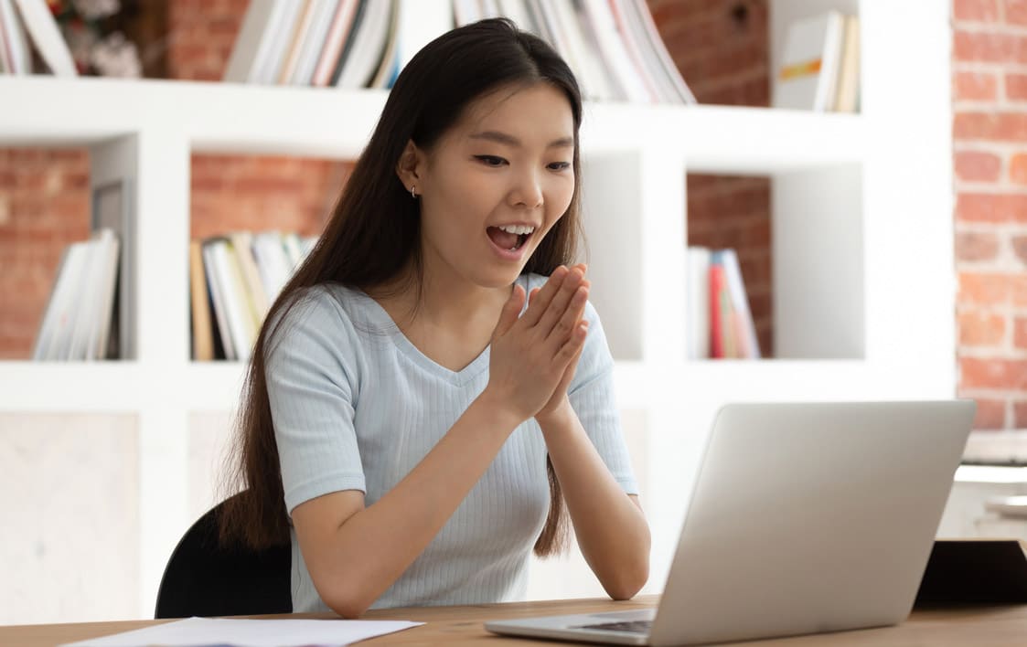 Excited Young Asian Female Student Received Mail With Good News.